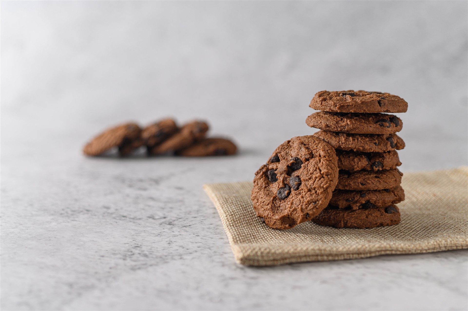pile-cookies-cloth-wooden-table